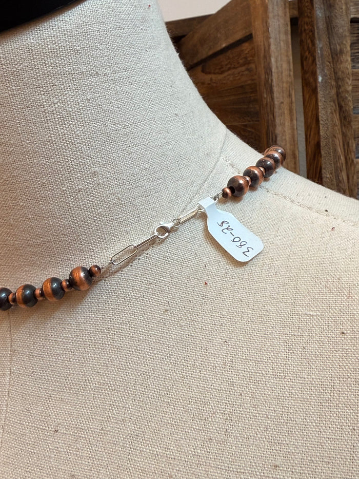 18-inch copper bead necklace with lobster clasp and small stamped tag detail