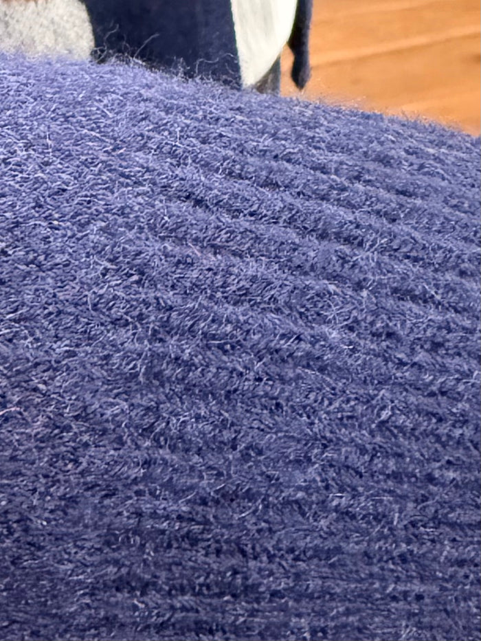 Navy cardigan sweater fabric texture with dense fuzzy knit surface