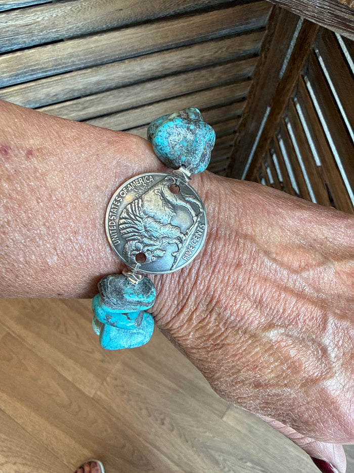 Turquoise chunk bracelet with buffalo coin charm and small link details
