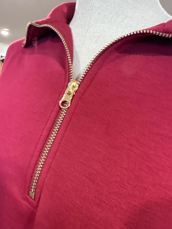 Burgundy quarter-zip T-shirt collar with zip placket and gold-tone zipper teeth