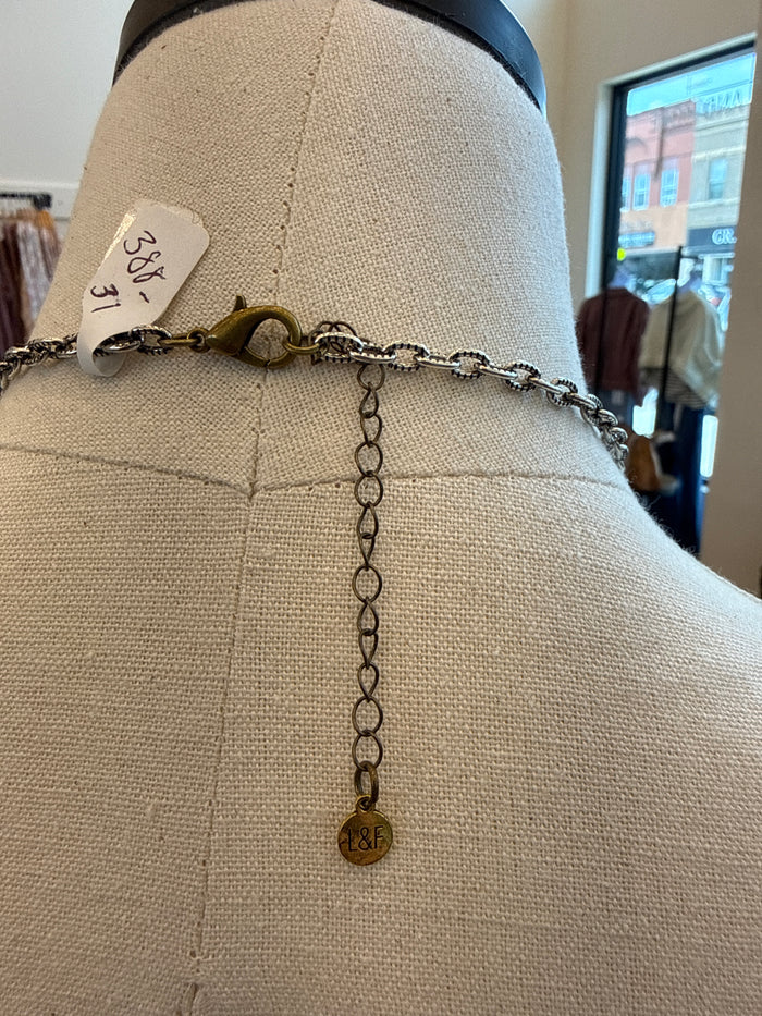 Silver-tone crystal beaded necklace with long drop chain and small round charm