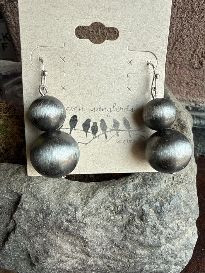 Double pearl fishhook earrings with two matte silver round drops