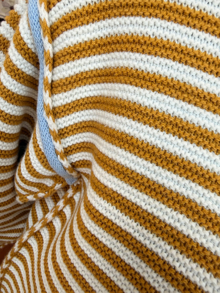 Striped crew neck knit sweater in mustard and white, ribbed cuffs and collar