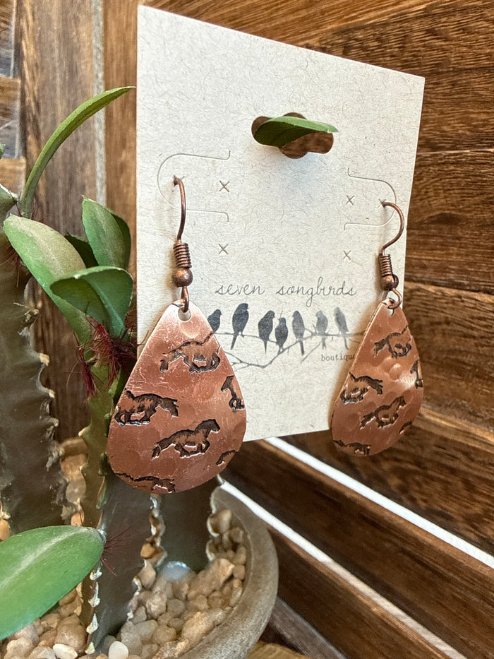 Copper teardrop dangle earrings with horse silhouettes and French-style hooks