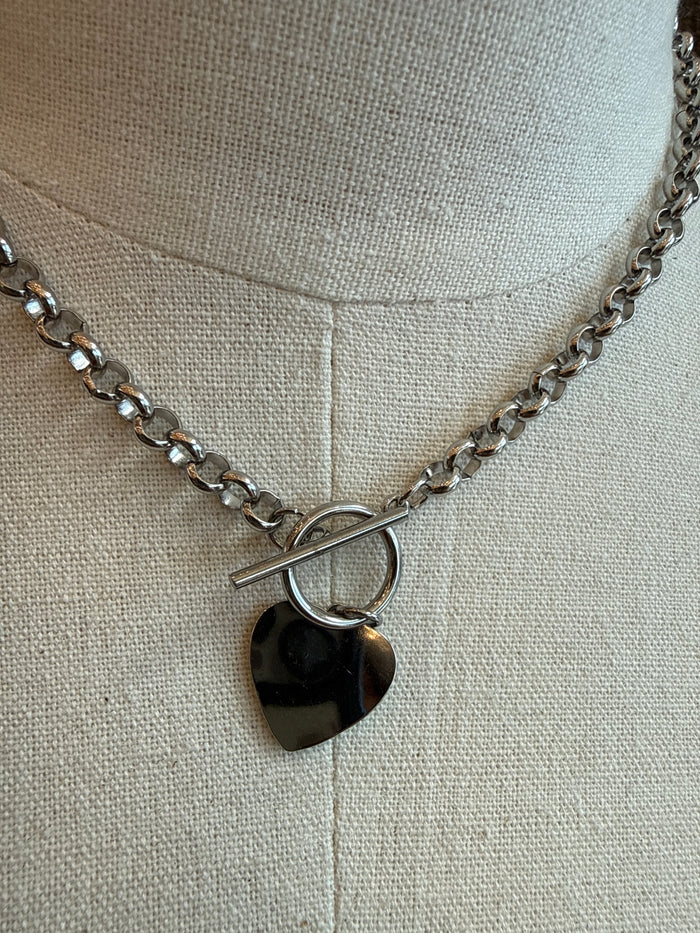 Silver chunky chain necklace with reflective heart pendant and toggle clasp