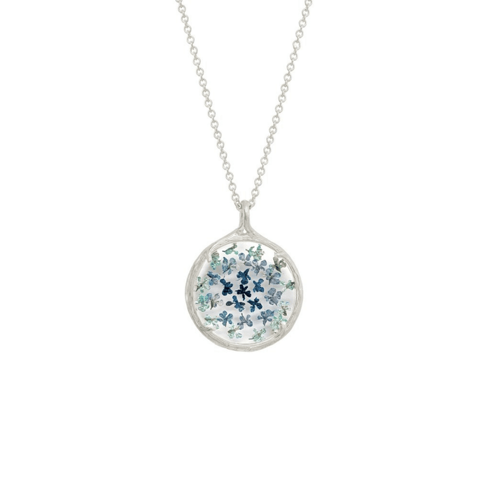 Small Ombre Botanical Necklace | Catherine Weitzman Jewelry featuring delicate blue and green floral designs encased in a round silver pendant on a fine chain.
