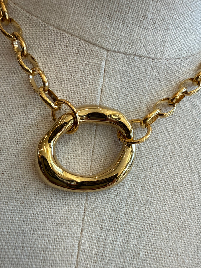 Gold-plated chunky circle chain necklace close-up of round ring pendant link