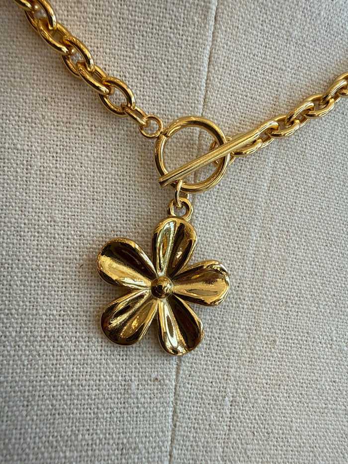 Gold daisy flower pendant necklace with ring toggle clasp and short link chain