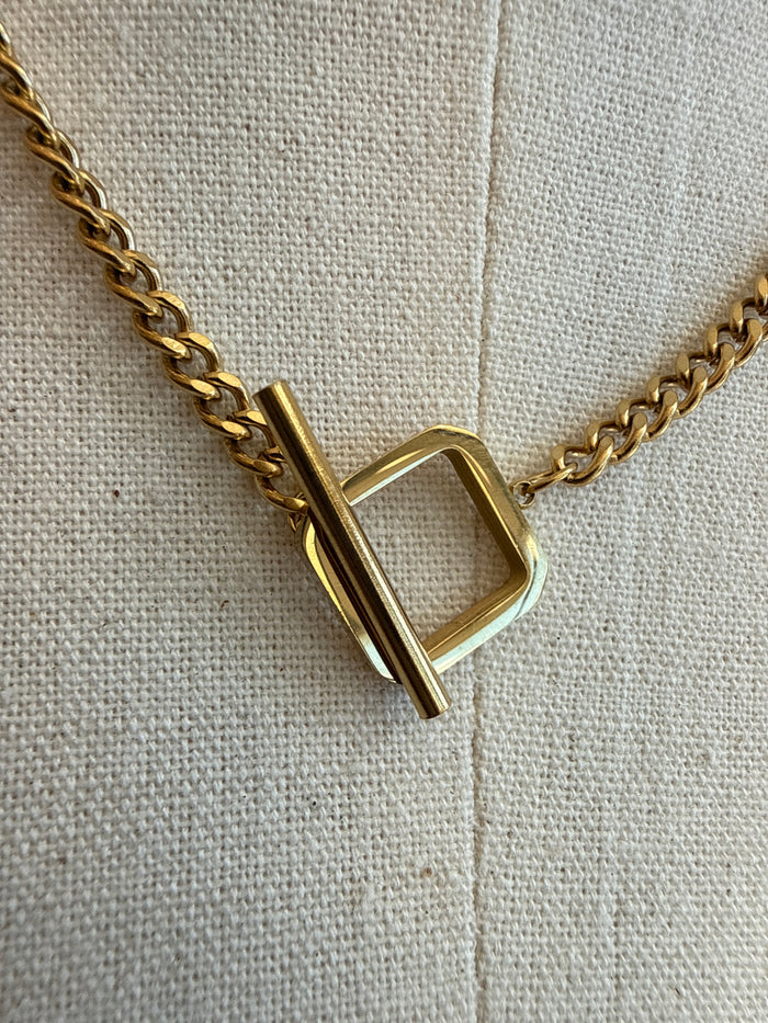 Gold-plated square toggle clasp necklace close-up of square toggle and chain links