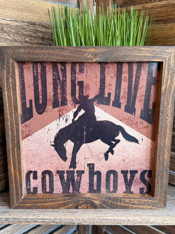 Rustic wood framed cowboy artwork featuring horse silhouette over 'Cowboys' lettering