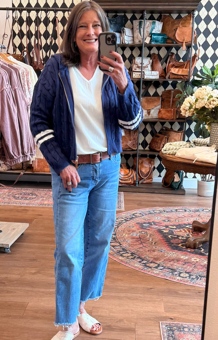 Navy cable-knit hooded cardigan with striped ribbed cuffs and front zipper