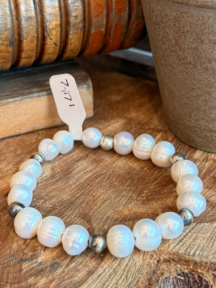 Stretchy freshwater pearl bracelet, iridescent white beads with small metal spacer accents