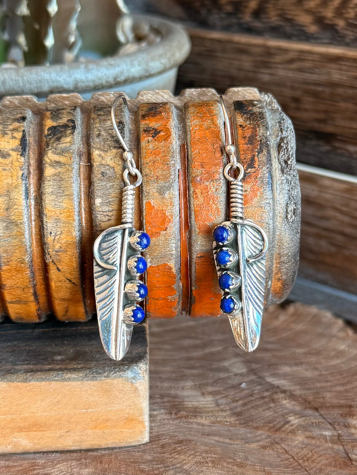Pair of silver feather fishhook earrings with blue lapis bead row
