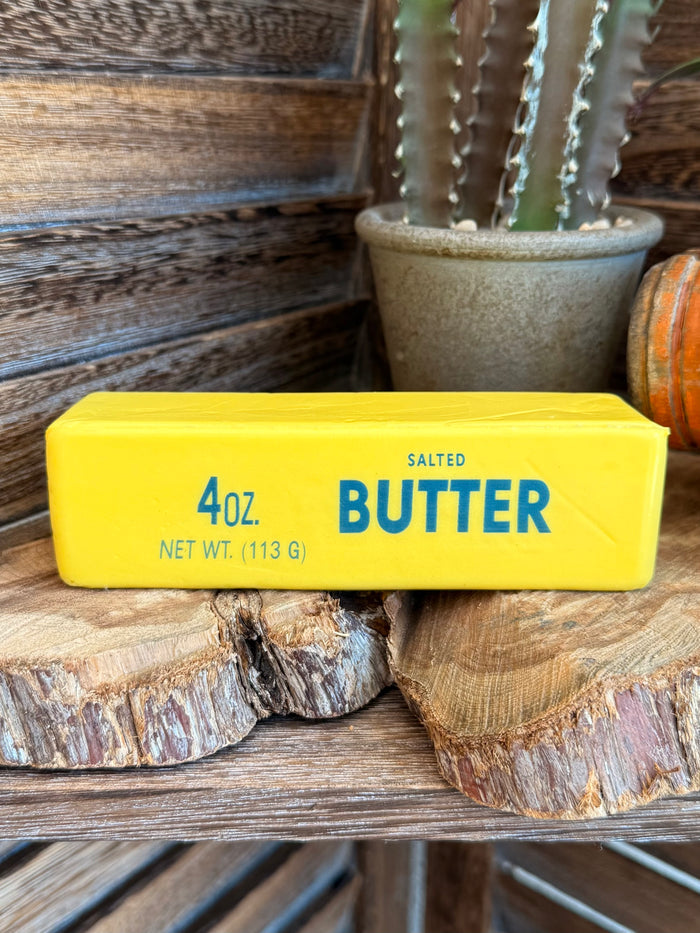 Yellow 4 oz salted butter squishy with “BUTTER” and “NET WT 113 G” text