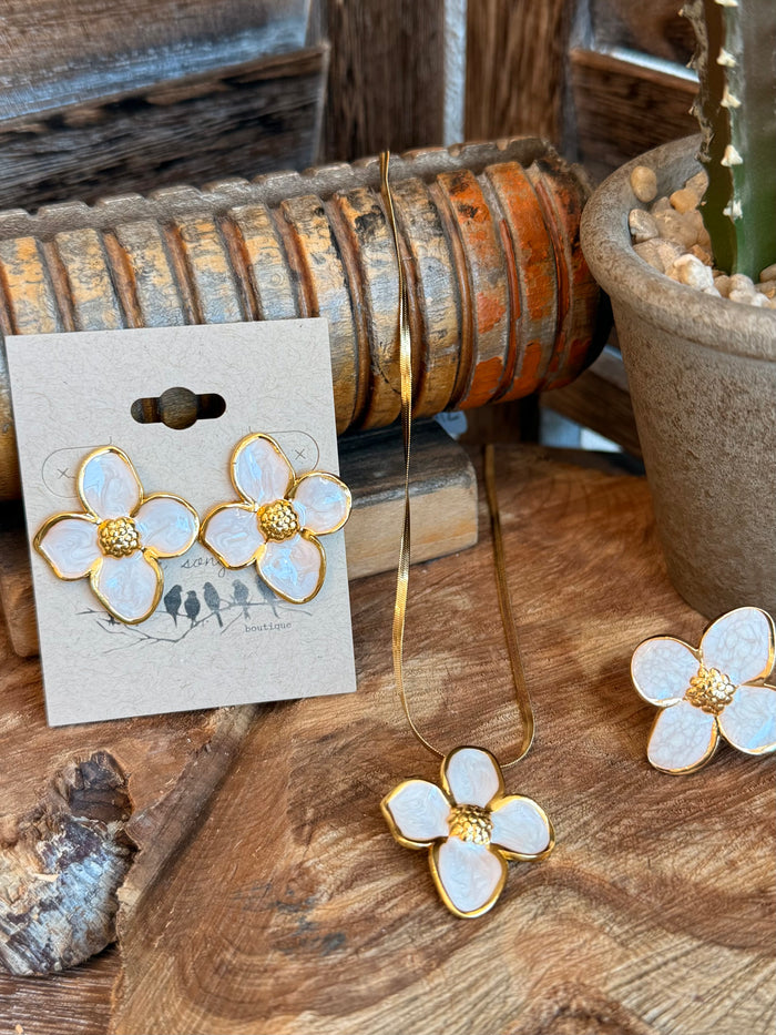 Gold-plated floral necklace pendant with white enamel petals and matching drop earrings