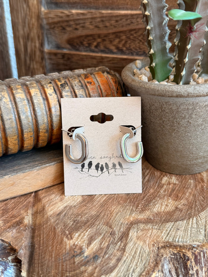 Silver-tone half-hoop stud earrings on card, round open hoops with iridescent inner edge