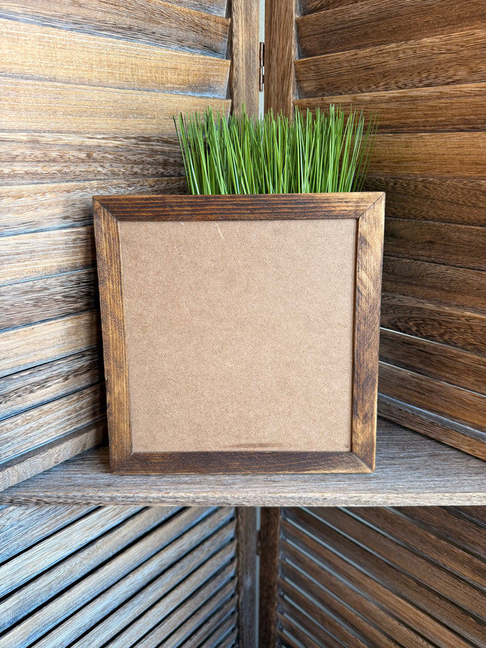 Framed blank artwork panel with textured beige center and rustic wood-look border