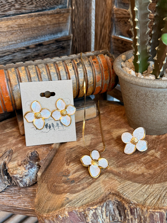 Gold-plated floral earrings with white enamel petals and gold beaded centers