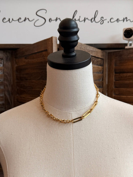 Gold plated chain necklace with alternating big and small links, on a bust display