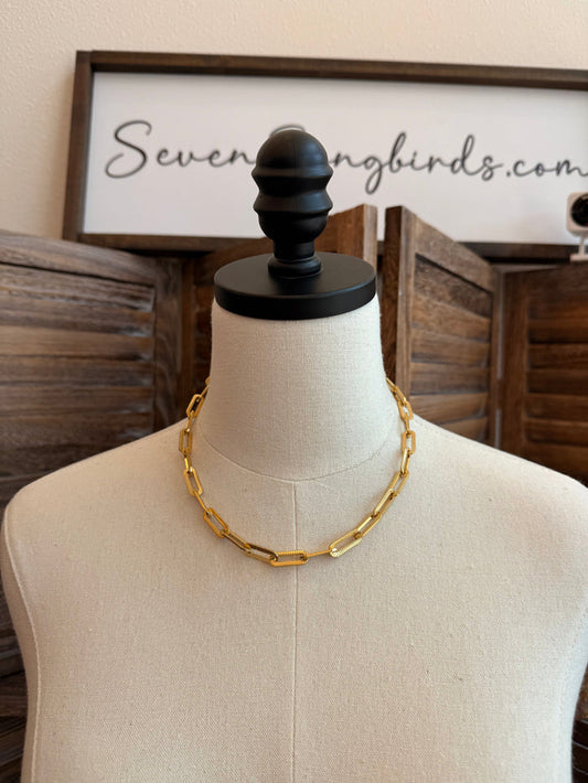 Gold-plated chunky chain necklace on mannequin, round oval links