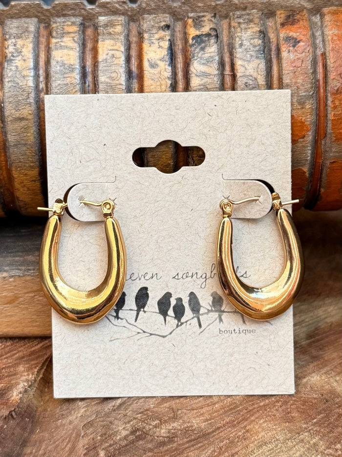 Gold crescent hoop stud earrings with small top accent, long drop design