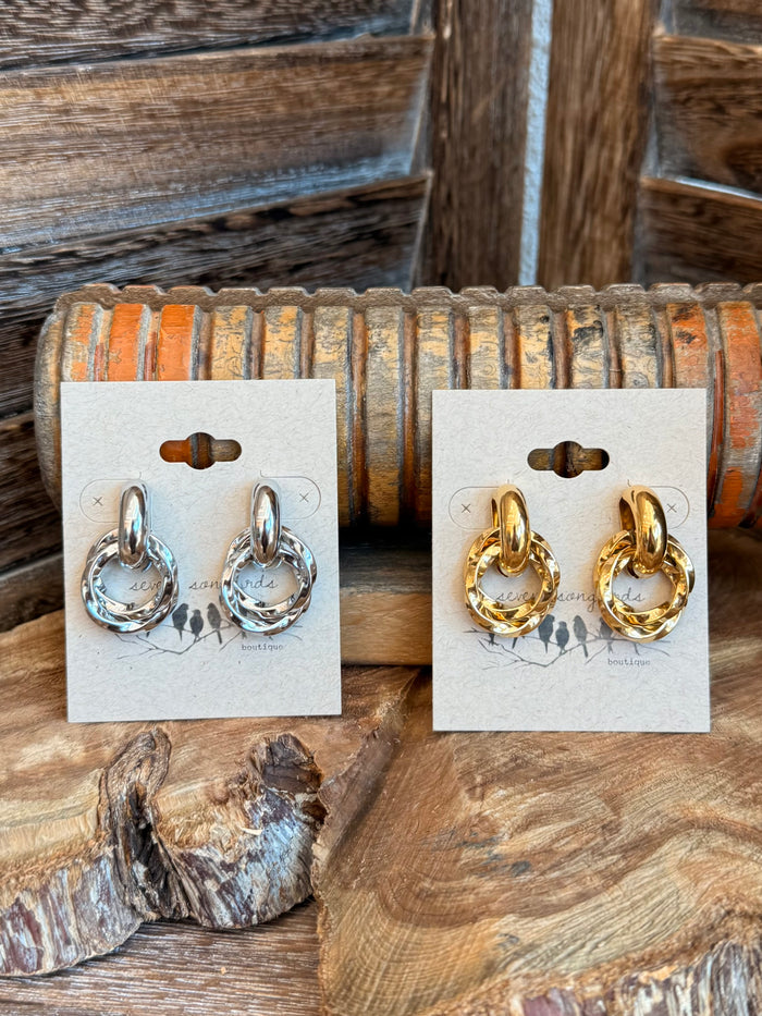 Twisted round stud earrings set: silver on left, gold on right on cards