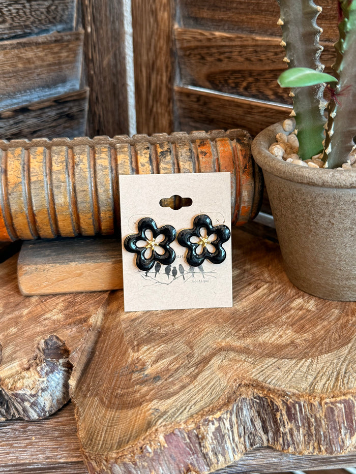 Black and gold flower stainless steel stud earrings on display card
