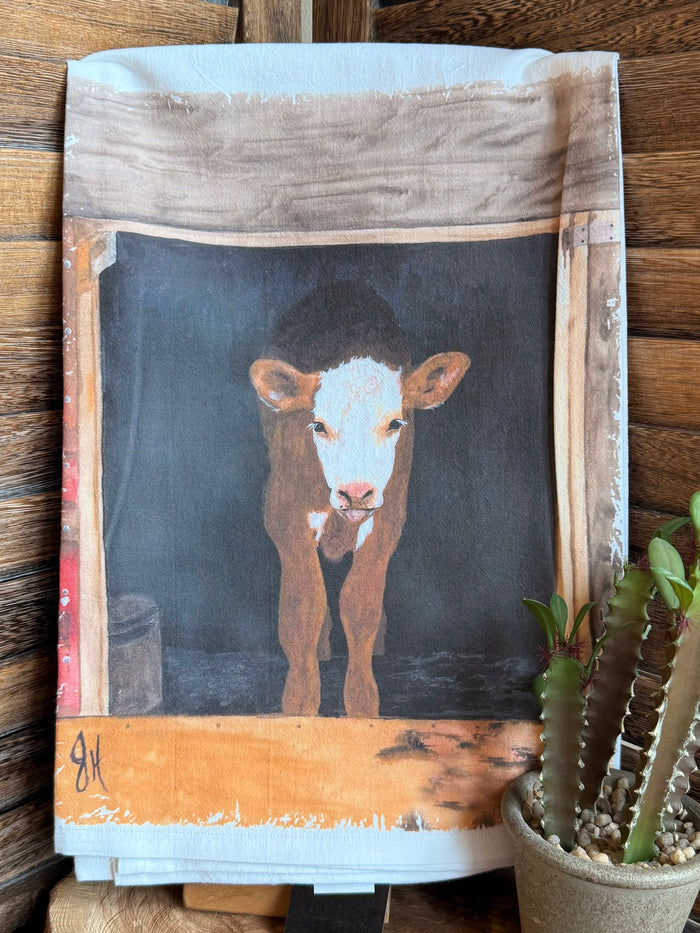 Small watercolor calf tea towel, blue-gray cow face with orange bottom splash border