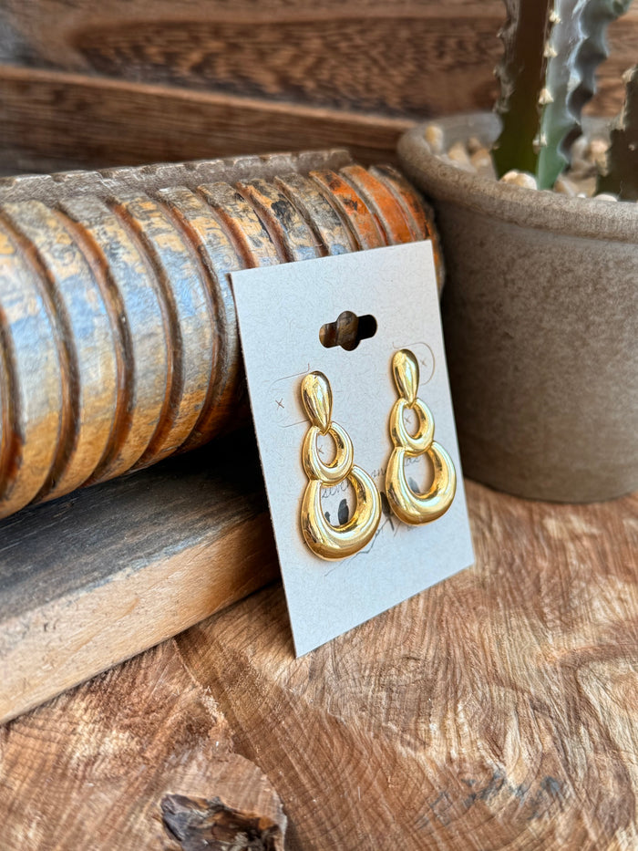 Gold-tone triple round drop stud earrings with layered oval hoops and hook posts