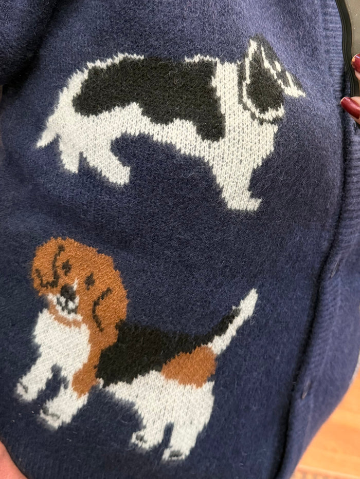 Navy cardigan close-up with knitted dog intarsia graphic and button front