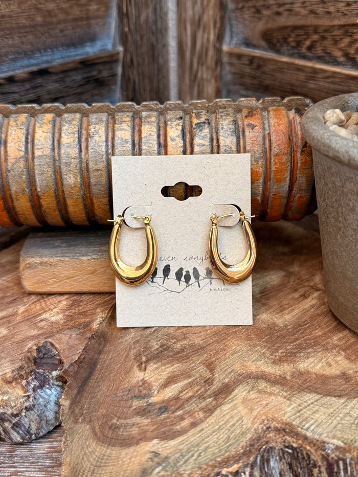 Gold crescent hoop stud earrings with long drop style, hinged back