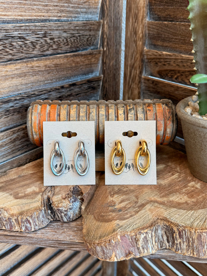 Double round stud earrings, gold and silver plated oval hoops on display cards