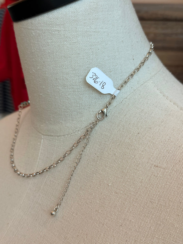 Longhorn outline necklace with gold-tone chain, small charm tag, and clasp