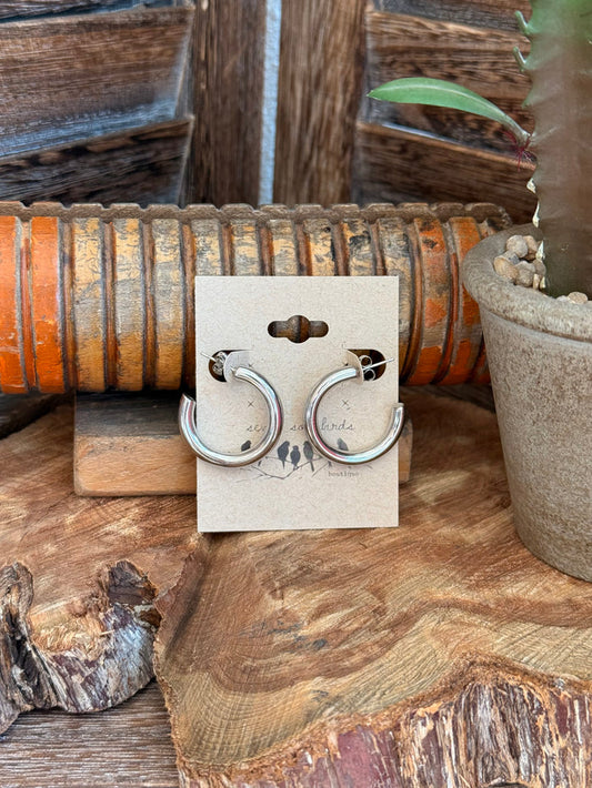 Silver stainless steel hoop earrings with front stud clasp, pair on jewelry card