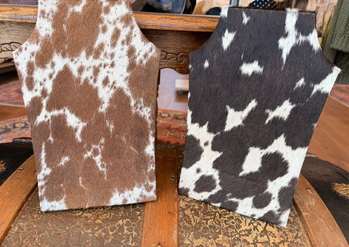 Cowhide necklace easel display in tan with white cowhide spots