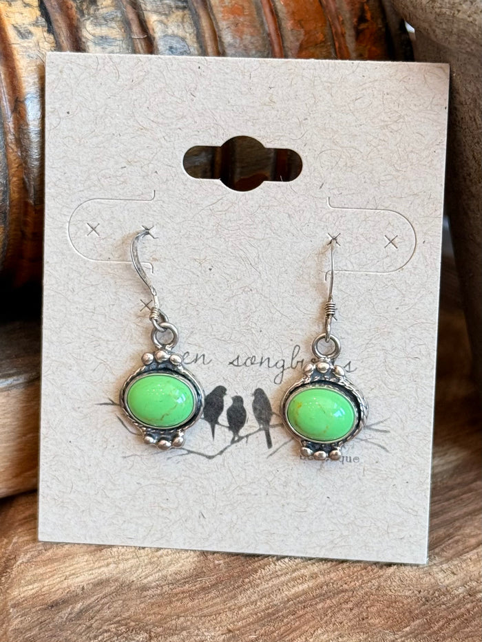 Sterling silver fishhook earrings with green oval gemstone in scalloped settings