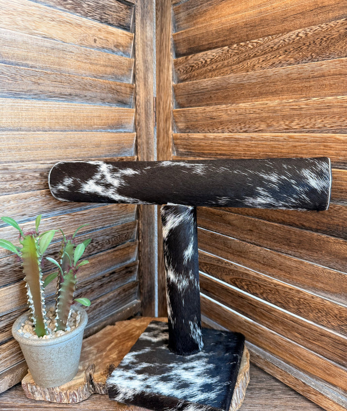 Cowhide bracelet display stand with black-and-white cowhide top bar and pedestal base