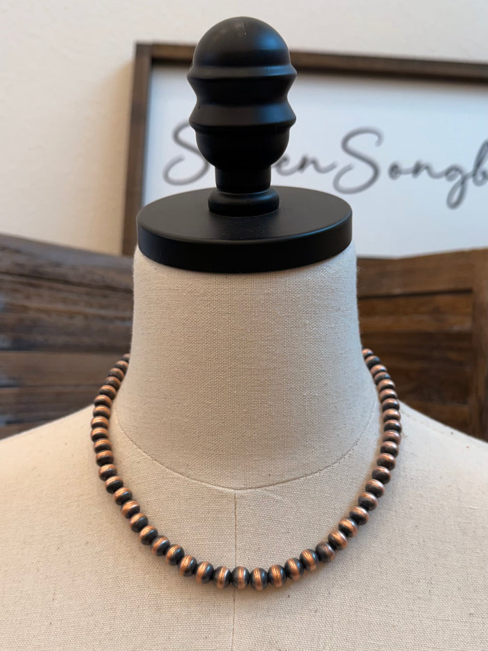 18 in copper bead necklace with round 8mm beads, shown on a mannequin