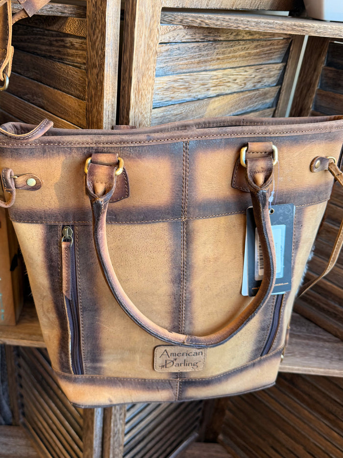 Leather cowhide crossbody purse with front straps and 'American Burlins' patch