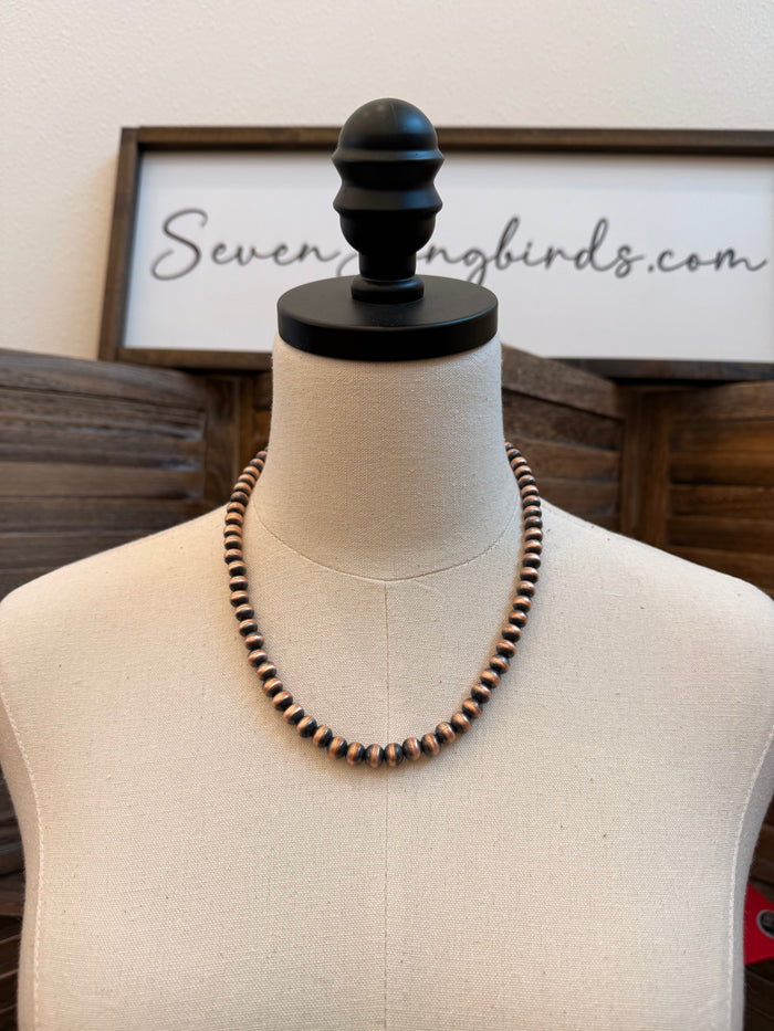Copper bead necklace with dark and bright round beads on a 20" chain