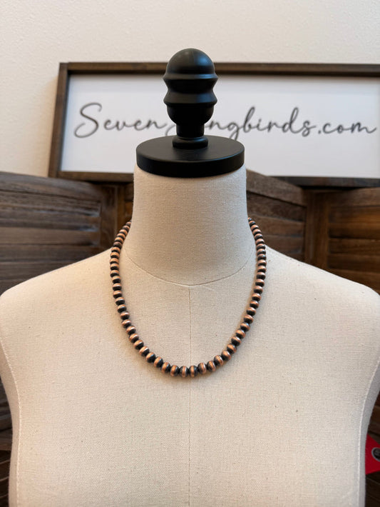 Copper bead necklace with dark and bright round beads on a 20" chain