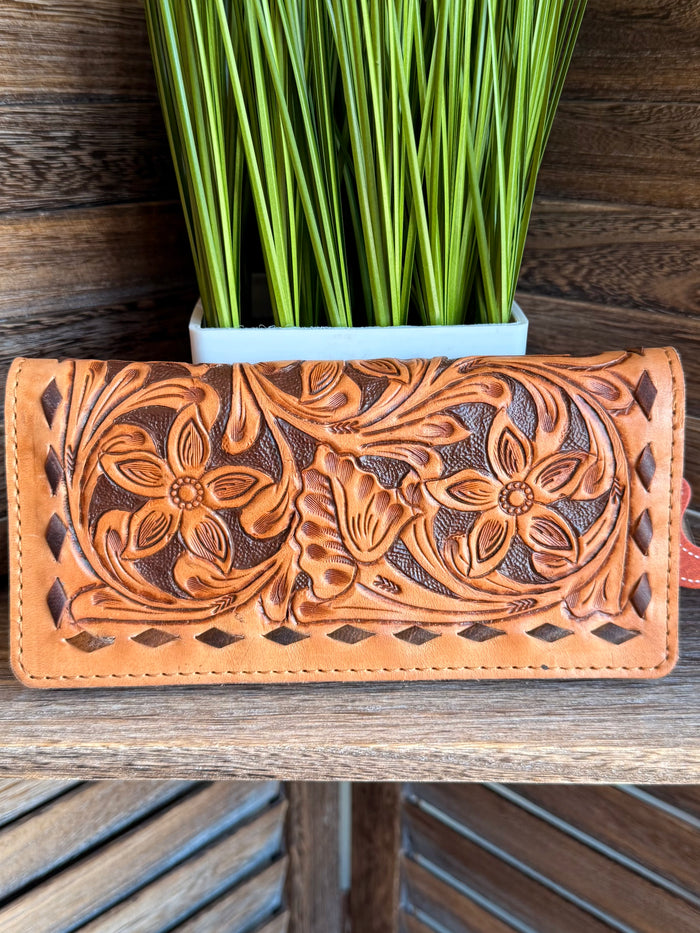 Tooled leather wallet with floral embossing and decorative stitched border, tan-orange