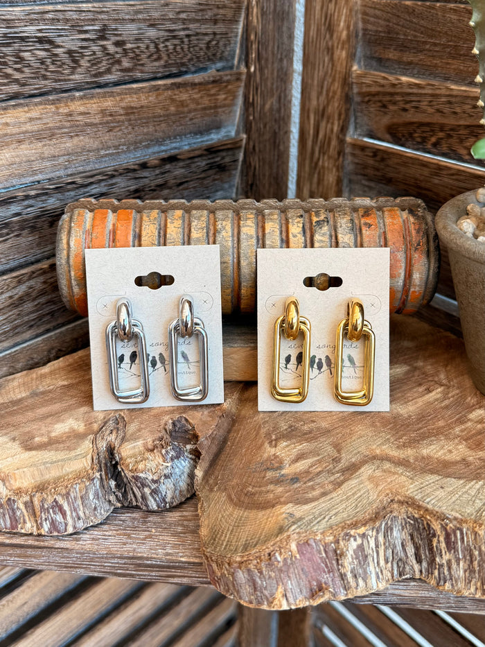 Paperclip stud earrings, silver and gold on display cards