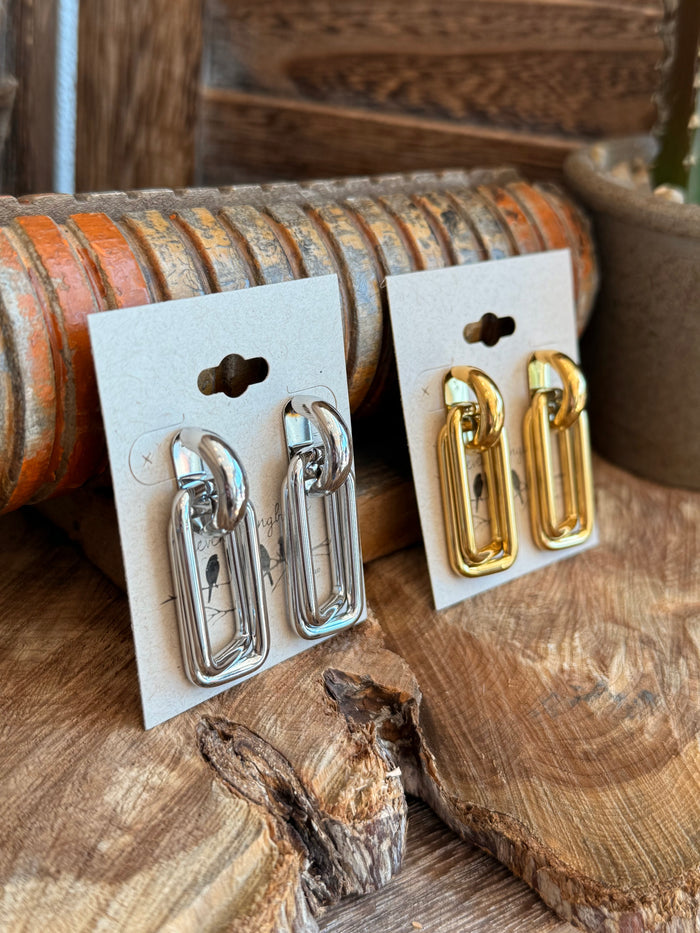 Paperclip stud earrings, silver and gold pairs on cards