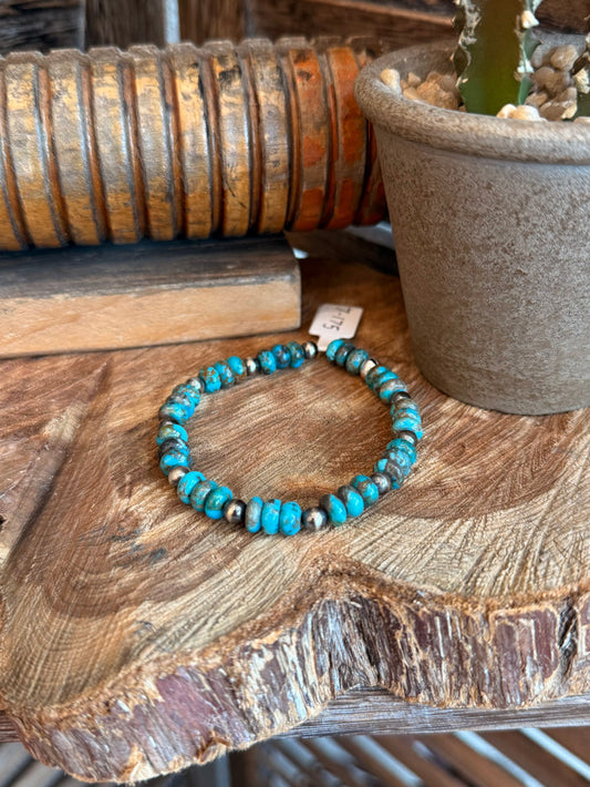 Turquoise bead stretch bracelet with silver-toned spacer beads