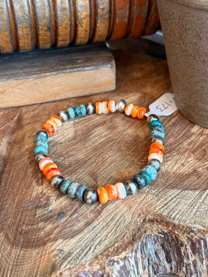 Turquoise and orange spiny oyster stretchy bracelet with silver spacer beads