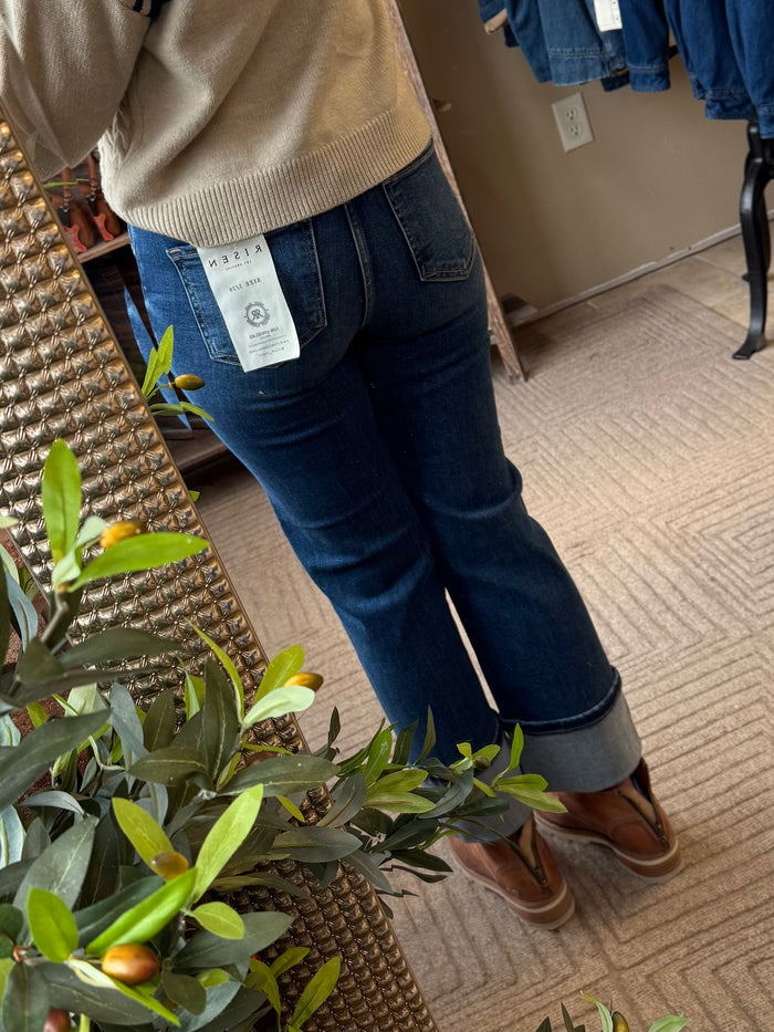 Dark blue cuffed jeans with front yoke seam and rear patch pocket