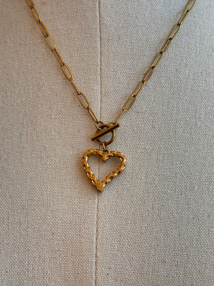 Gold-plated heart pendant necklace with toggle clasp and linked heart detail