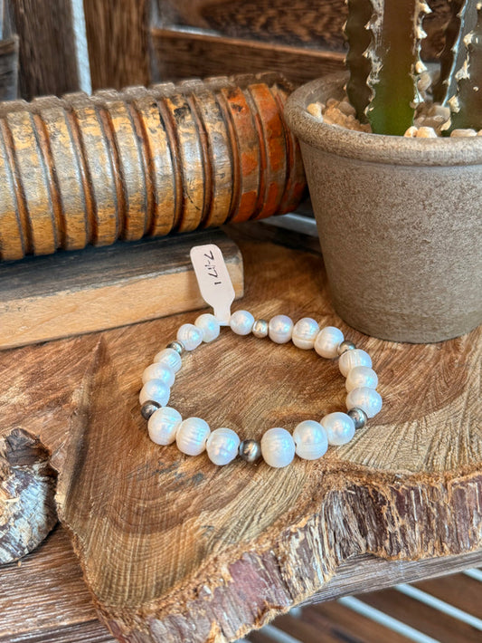 Stretchy freshwater pearl bracelet with iridescent white beads and metal spacers