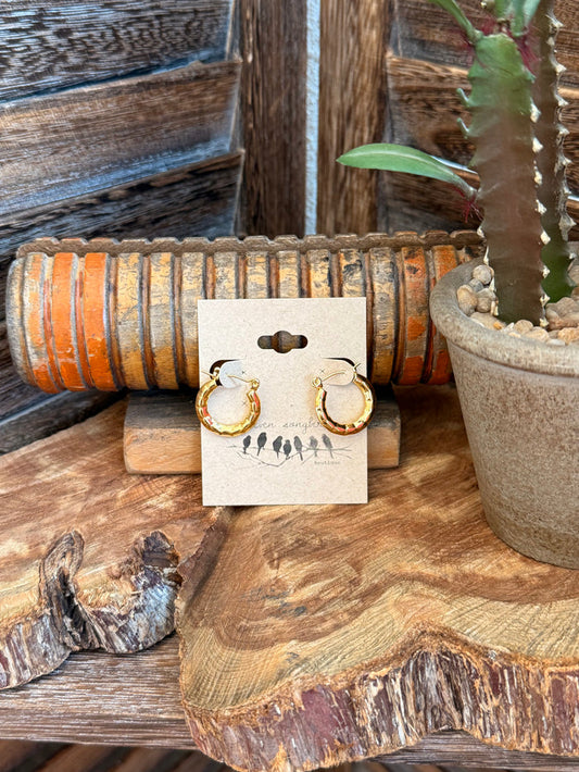 Gold-plated crescent stud earrings with textured detail, small hoop-like shape